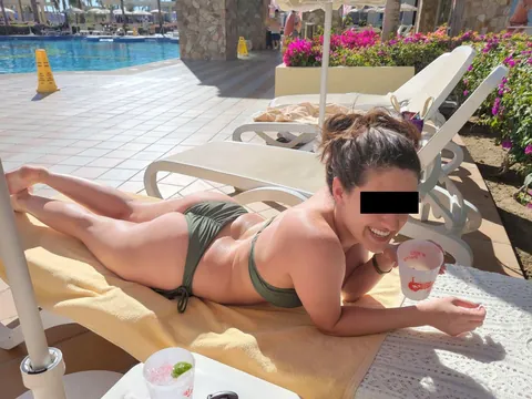 She's working on her tan, which means she's ready for a new beach. Who's got some spicy ideas?