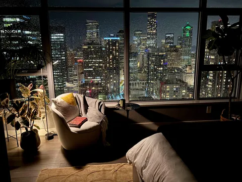 Reading to the sound of wind and rain in the city