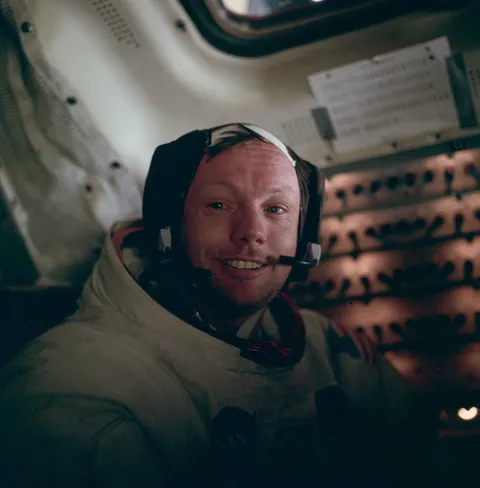 Aldrin snapped this shot in of a teary-eyed Armstrong moments after he returned to the spacecraft and removed his helmet, 1969.