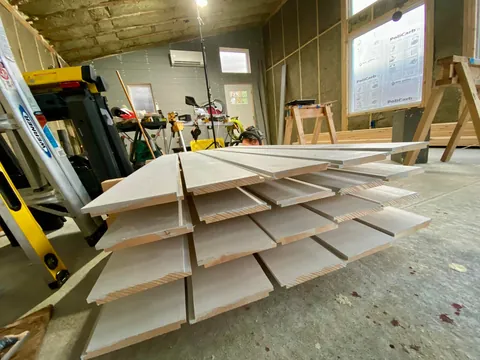 I built a 500 sq ft backyard shed studio for my photography business. I personally handled every phase from design to completion except for concrete, electrical, and HVAC. It's insulated and comfortable year round here in New Hampshire.  Ask me anything!