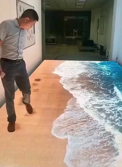 A designer decorated an apartment floor with LED lights, creating the feeling of being on a beach.