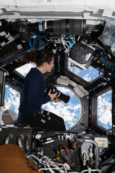 NASA Astronaut Christina H. Koch, International Space Station Flight Engineer, "looks through the station's 'window to the world,' the seven-windowed cupola" on 11 Aug 2019. She "was photographing landmarks as the orbiting lab flew 259 miles above the Atlantic Ocean off the coast of South America."