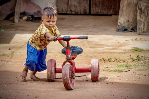 Little Cambodian boy saw me (American tourist) coming up the dirt road. He raced into a shed, and hurried back out to show me his bike before I was gone. The look of unfiltered pride on his face will always stick with me.