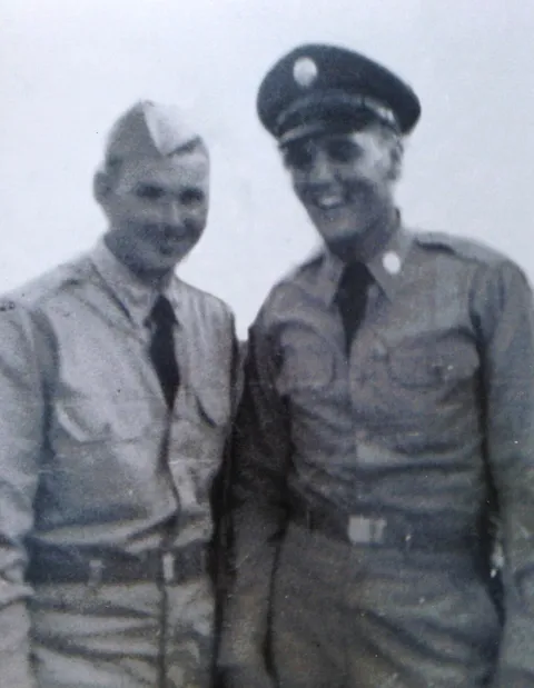 1958, My grandfathers best friend in the Army was Elvis. He got an iPhone just so he could show EVERYONE this picture.