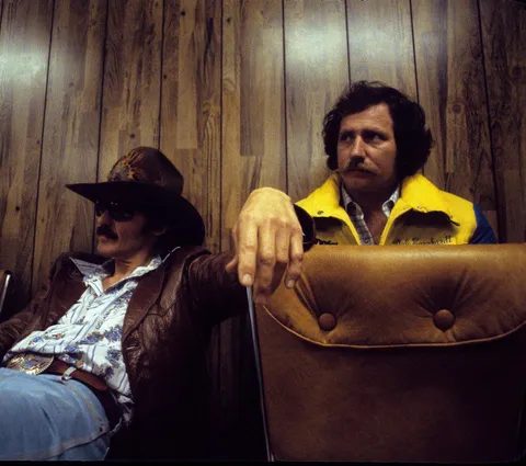 Richard Petty and Dale Earnhardt in a pre-race drivers' meeting, 1980's