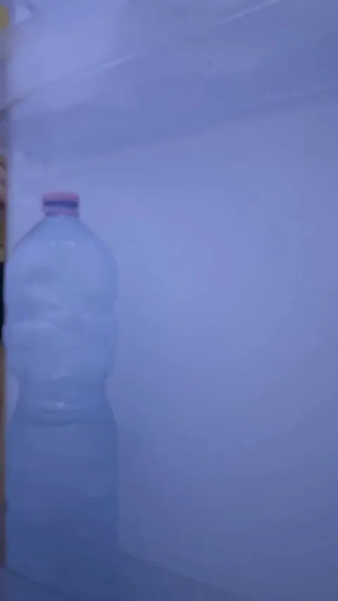 Busty student looks for breakfast in the refrigerator