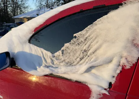 The way the snow melted on my car looks like a wet towel.