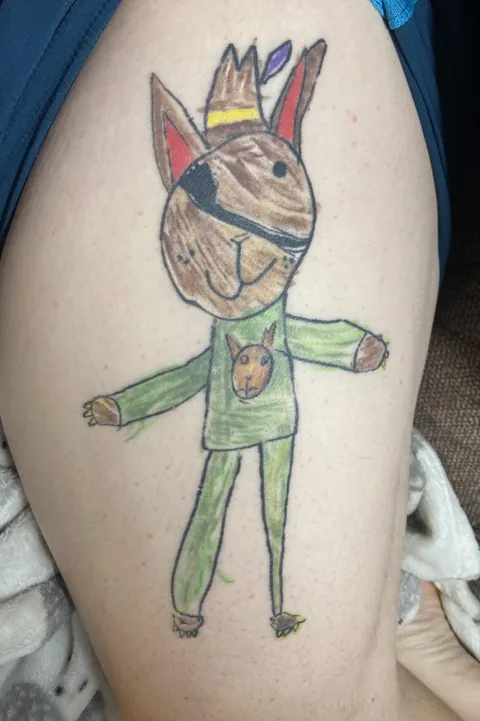 Get a tattoo of your kid's drawing: Dog Pirate. (Boston)