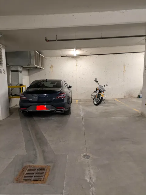 Resident in neighboring right stall complained they have trouble parking because our car is too close to the line