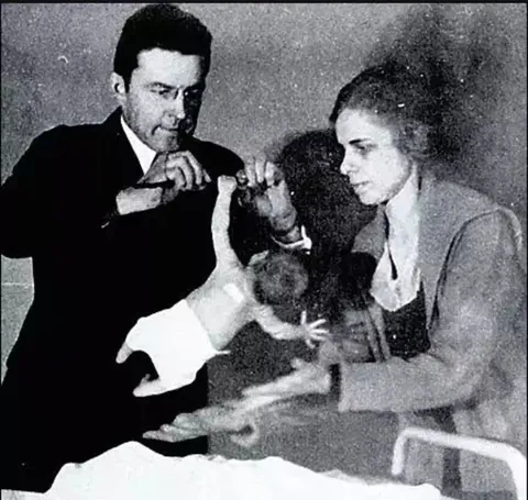 PsBattle: Newborn baby hanging on a bar with one hand