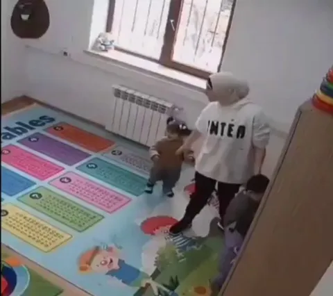 Teacher hugs a crying kid so all the other kids wanted a hug too