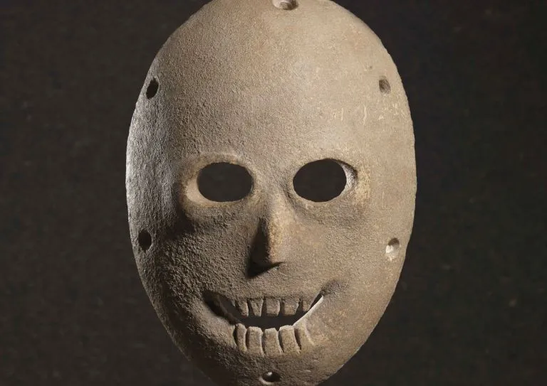Neolithic limestone cult mask found in Israel. Historians believe shamans or tribal chiefs wore the mask during a ritual masquerade honoring the deceased.