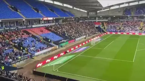 A Plymouth fan takes some stick from the Bolton fans, he decides to embrace it!