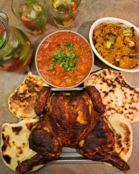Tandoori style spatchcock chicken, dopiaza, vegetable biryani and naan served with strawberry mojitos [OC]