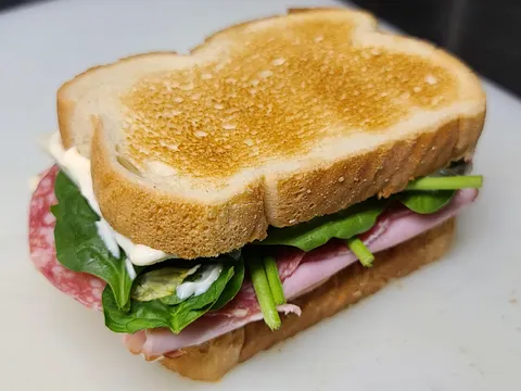 i present, my sandwich (toasted bread with butter, salami, turkey, spinich and some mayo on the night shift of the ship I work on)