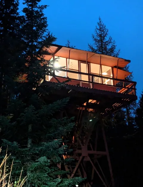 A cozy fire lookout in the middle of the forest