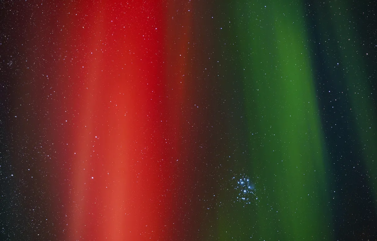 Pleiades shot through the Aurora.