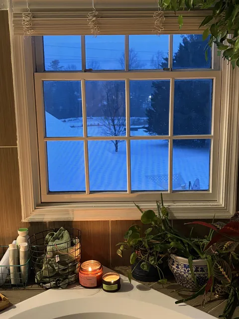 Book and a bath on a snowy night - looking out on the frozen pond