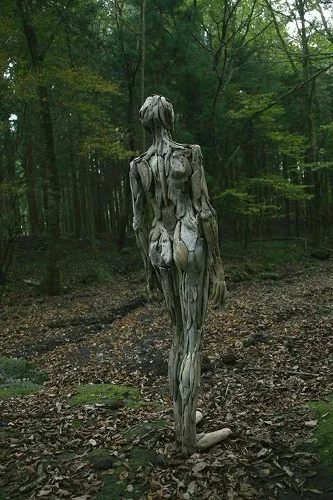 Eerie humanoid sculptures made out of driftwood by Japanese artist Nagato Iwasaki.