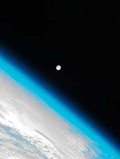 Photo of the Earths atmosphere and the moon. Shot by the international space station.