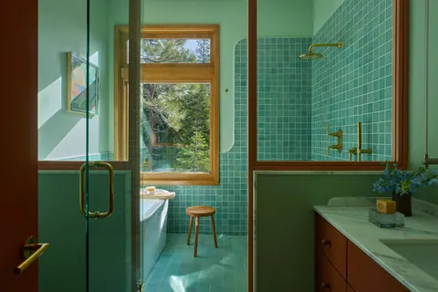 Main bathroom full of natural light and a glass partition in a renovated 1964 Mid-century modern Tahoe residence, Alpine Meadows, California [2880x1921]