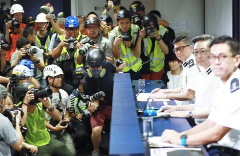 Hong Kong press wears helmets, eye masks and reflective vests to express discontent towards local police's actions.