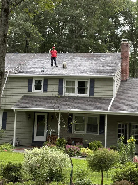 Man mopping his roof