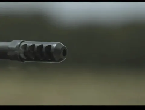 A muzzle brake diverting gasses to dampen movement of a rifle. 