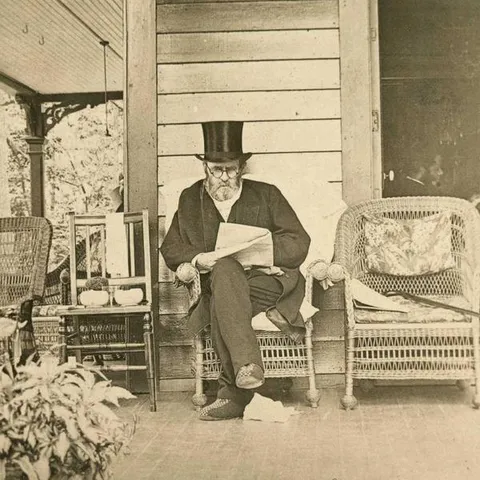 President Grant reading a newspaper 4 days before he died of throat cancer. He wore high collars shirts to hide his tumors and became mute towards the end.