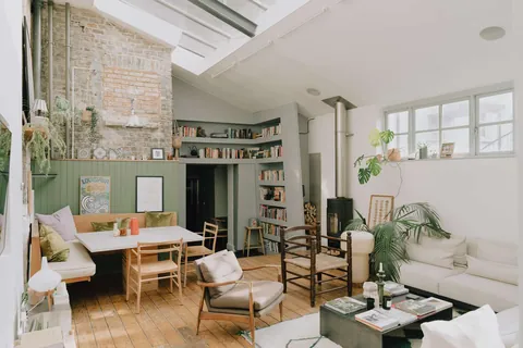 Living room with skylights in a 1900s wood workshop converted into a two-bedroom apartment, Camden, London, UK [1600x1067]
